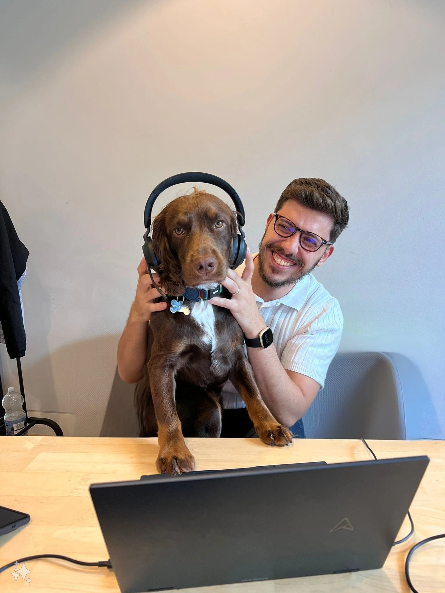 Charles Kyriakou with dog and telephone headset